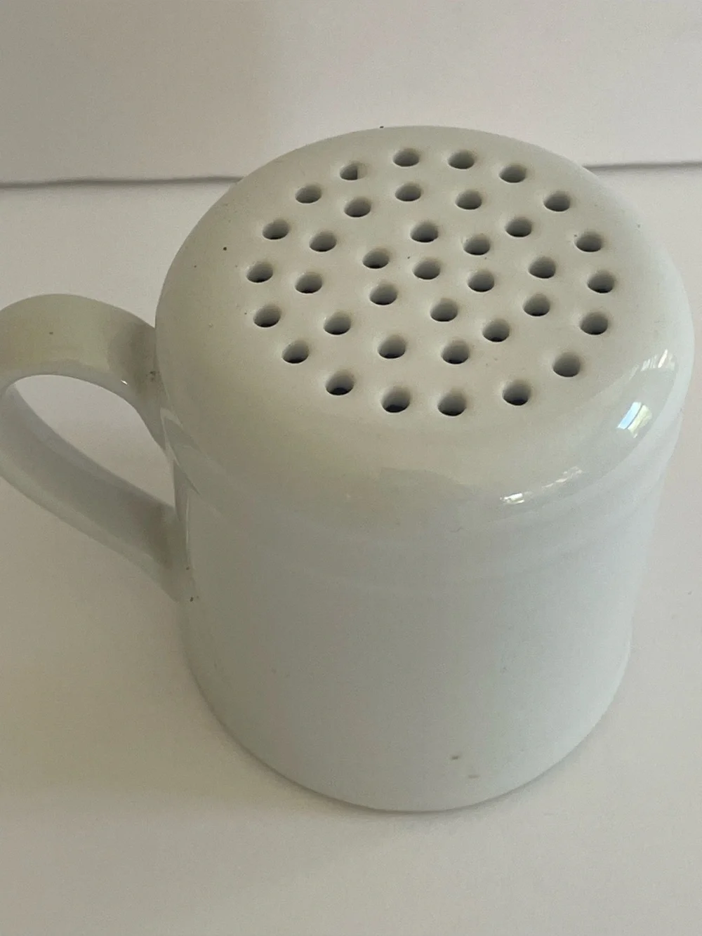 Red and White Ceramic Shaker with “Gimme some Sugar” writing